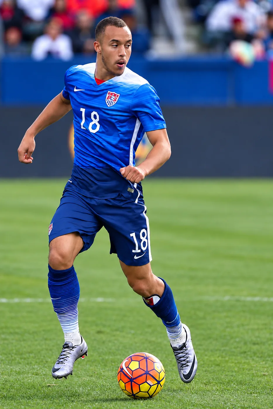 Jerome Kiesewetter dribbling in a blue United States jersey