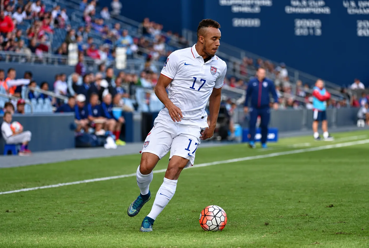 Jerome Kiesewetter on the ball in a white United States jersey
