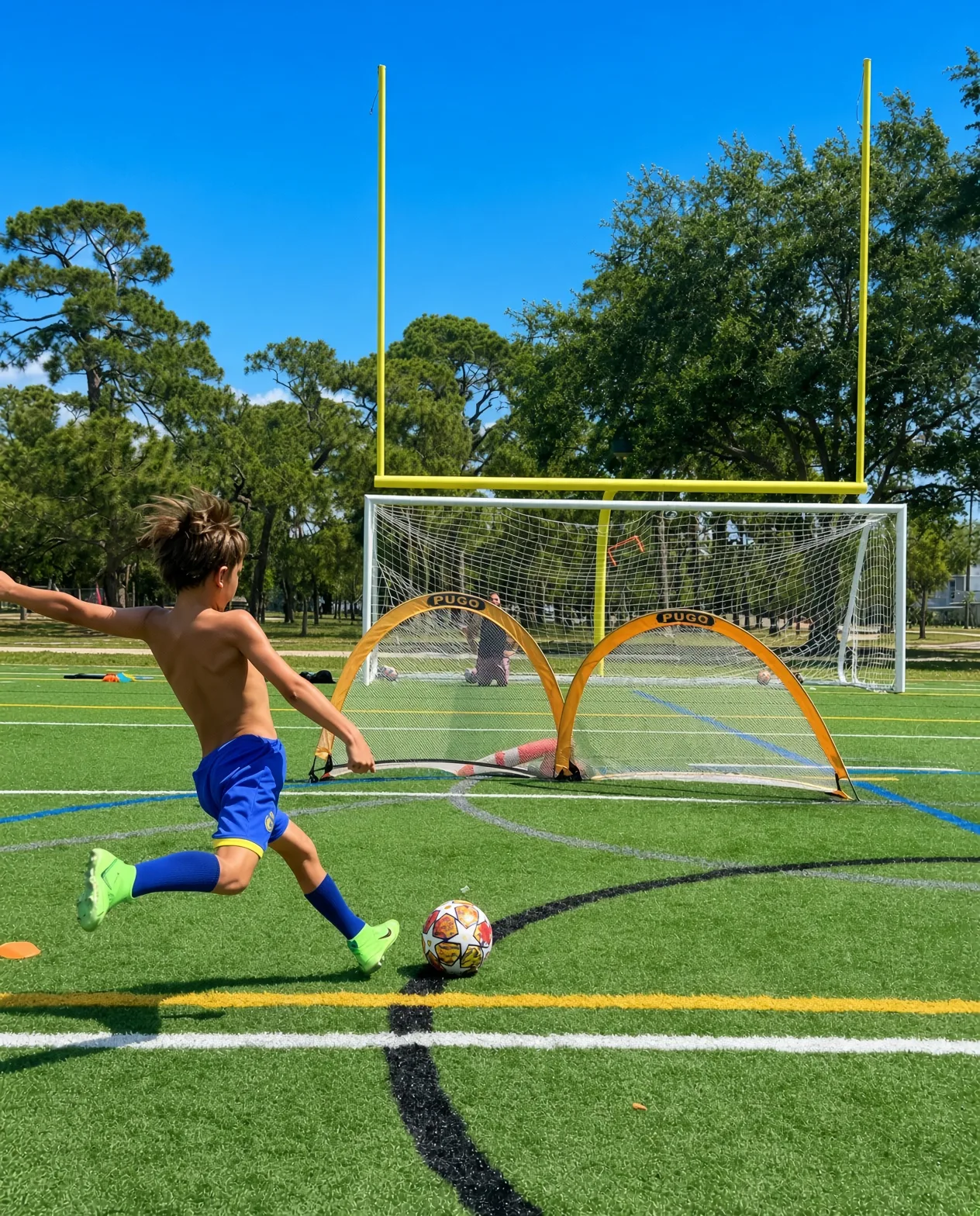 A player striking toward a pair of training goals